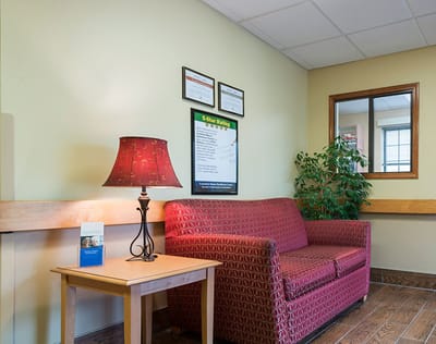 Common area with a sofa and lamp