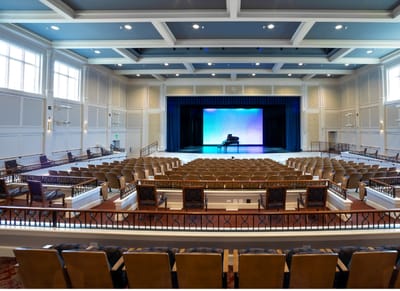 Interior view of a large auditorium space with seating