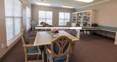 Craft room with tables and chairs for activities