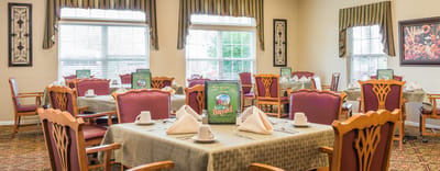 Dining area with neatly set tables and decor