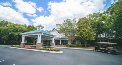 Front entrance of Wildewood Downs Retirement Community with outdoor space