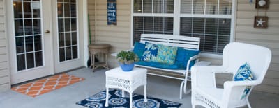 Cozy outdoor seating area with chairs and decor