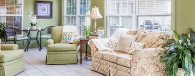 Bright common area with comfortable seating and plants