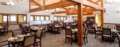 Spacious dining room with tables set for meals