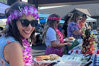 Participants enjoying food and festivities at a community event