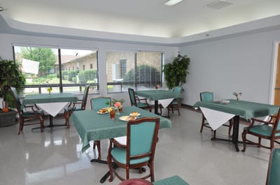 Dining area with tables set and food visible