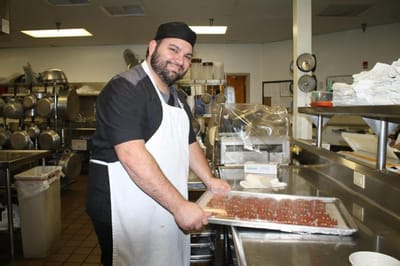 Chef preparing food in the facility kitchen