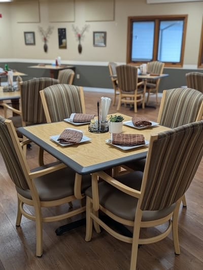 Dining room setup with neatly arranged tables