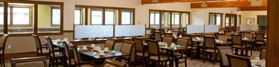 Interior view of a dining room with tables and chairs