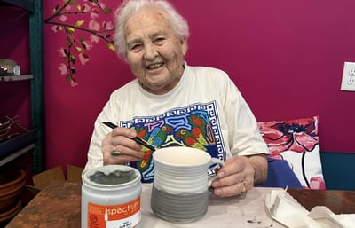 Resident engaged in pottery making activity