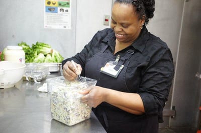 Staff member preparing food in the kitchen