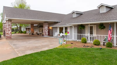 Exterior view of the assisted living facility with garden