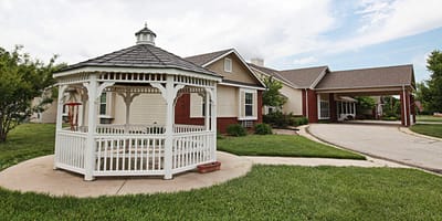 Exterior view of a facility with gazebo and landscaping.