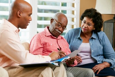 Residents and staff engaged in conversation.