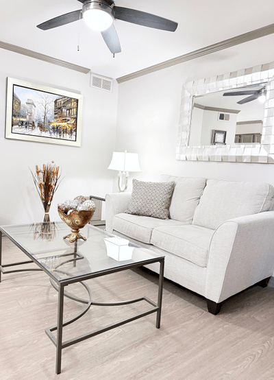 Cozy living room featuring a sofa and artwork.
