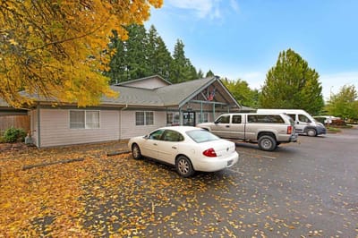 Exterior view of the facility with autumn leaves.