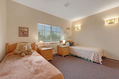 Comfortable shared bedroom in assisted living facility.