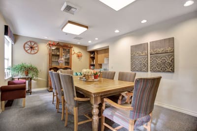 Common area with a large dining table and chairs