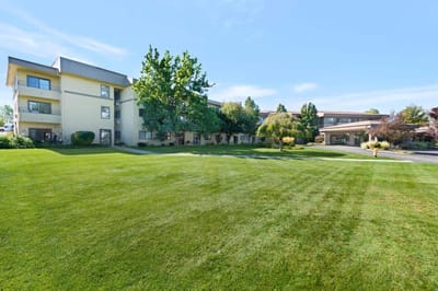Exterior view of the assisted living facility and lawn.
