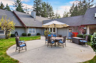 Outdoor patio with seating and an umbrella