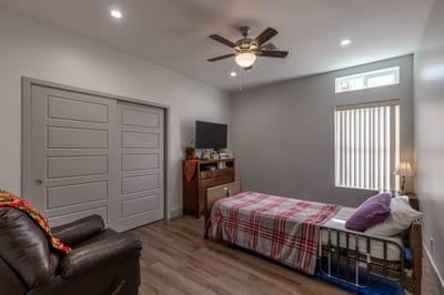 Private resident room with bed and furniture