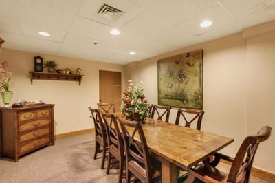 Cozy common area with a dining table and artwork.