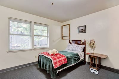 Cozy resident room with a bed and decor.