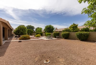 Serene outdoor space with landscaping and seating area.