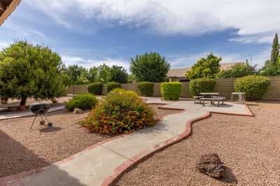 Scenic outdoor garden path with seating areas
