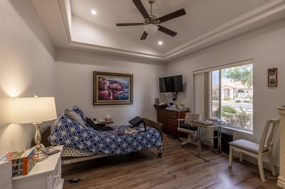 Private resident room with bed and window view.