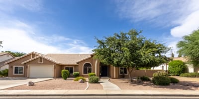 Exterior view of a residential building with landscaping.