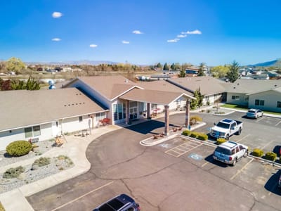 Aerial view of Emerald City Senior Living facility entrance.