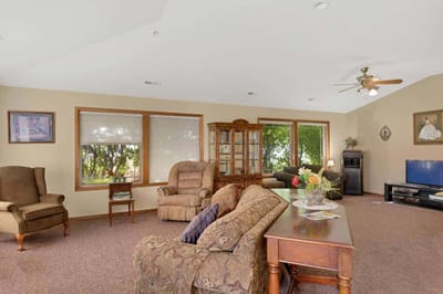 Comfortable common area with seating and windows