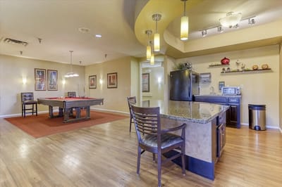 Common area with pool table and kitchenette