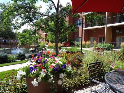 Lush garden area with colorful flowers and seating