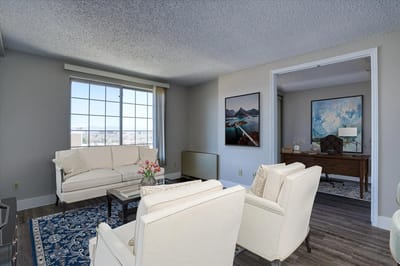 Bright and welcoming common area with seating and art.