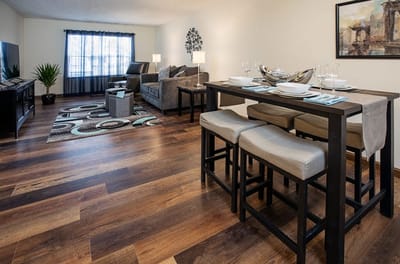 Cozy living area with dining space in a resident room.