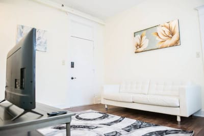 Bright interior living area with a sofa and artwork