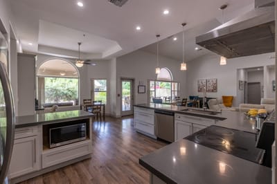 Modern kitchen with natural lighting and seating area
