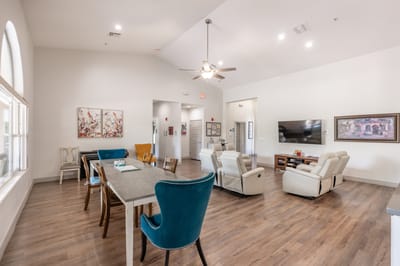 Spacious common area with seating and art decor.
