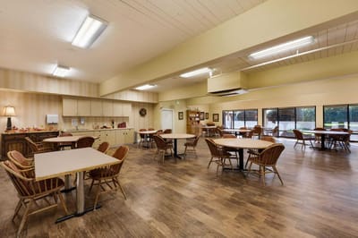 Bright, spacious dining area with tables and chairs