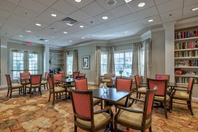 Interior common area with tables and bookshelves