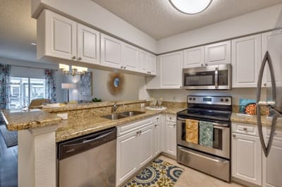 Modern kitchen with granite countertops and stainless steel appliances