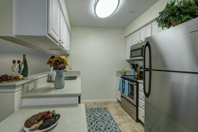 Well-equipped kitchen with fresh flowers and food