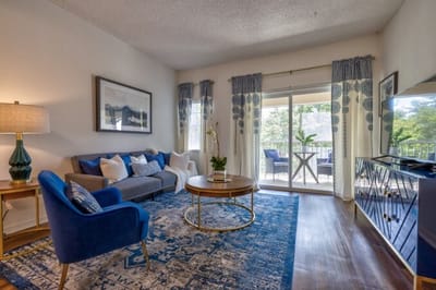 Cozy living room with a sofa and balcony access