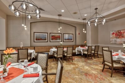 Elegant dining room with decorated tables and light fixtures