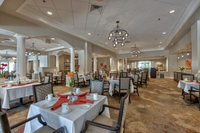 Elegant dining room setup with tables and chairs