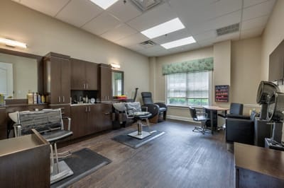 Interior view of a salon with salon chairs and equipment