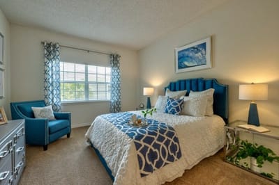 Cozy bedroom with blue accents and natural light