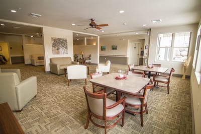 Bright common area with seating and tables